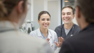 Clinic professional comforting a client with a smile.